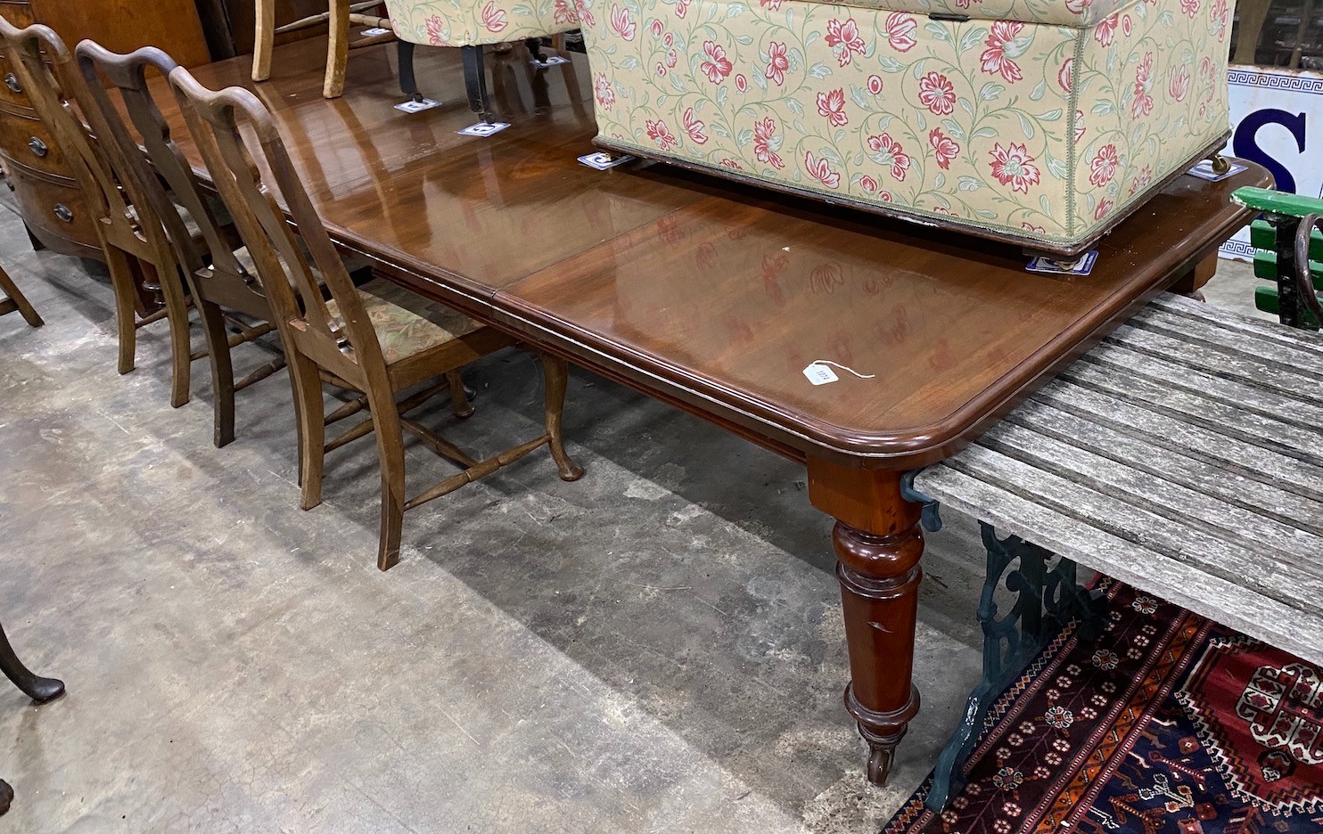 A Victorian mahogany extending dining table on turned legs, length 302cm extended (two spare leaves), depth 120cm, height 73cm